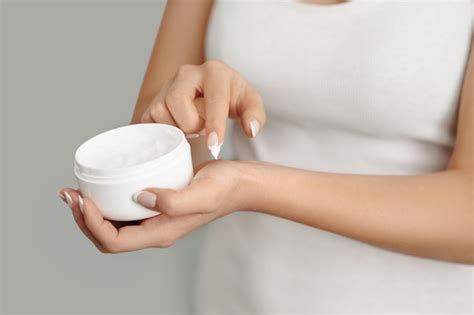 Premium Photo Closeup Woman Applying Protective Cream On Hands Hand