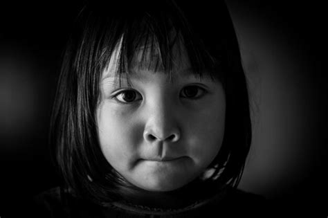 Premium Photo Close Up Portrait Of Cute Girl Against Black Background