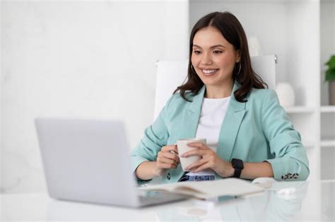 Premium Photo Glad Millennial Caucasian Lady In Suit Resting At