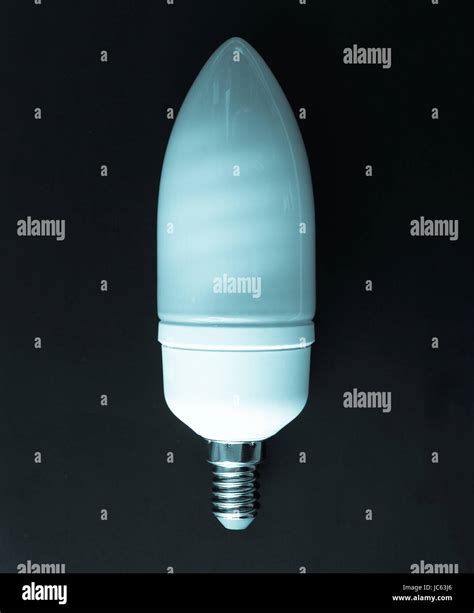 A Fluorescent Neon Energy Saving Light Bulb Over Black Background