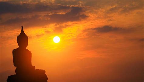 Silhouette of Buddha statue at sunset 1226623 Stock Photo at Vecteezy