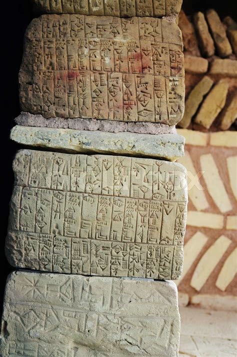 This photograph represent natural stones with ancient Sumerian writing ...