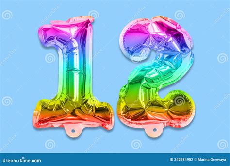 Rainbow Foil Balloon Number Digit Twelve On A Blue Background