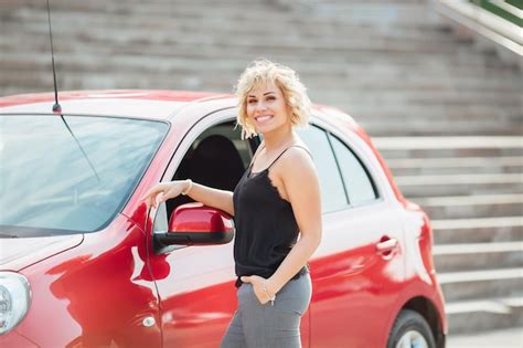 Premium Photo Attractive Blonde In A Car Showing Keys