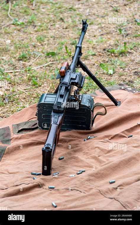 Soviet-made PK machine gun and camouflage netting.. "Kalashnikov's ...