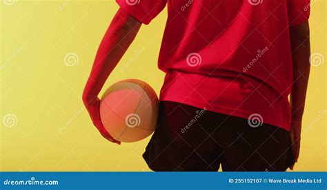 Rear View Of African American Female Rugby Player With Rugby Ball Over