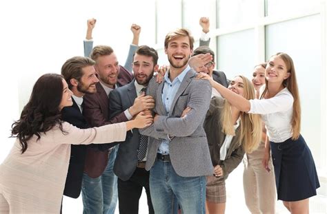 Premium Photo Happy Business Team Congratulating Their Leader Success