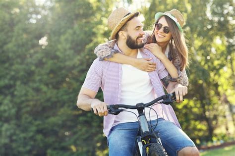 Premium Photo Romantic Couple Riding Bikes