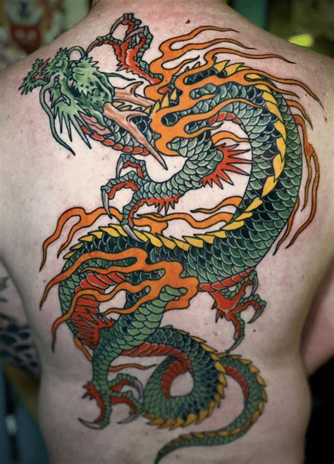 35 Rejuvenating Green Dragon Tattoos To Breath Back Life