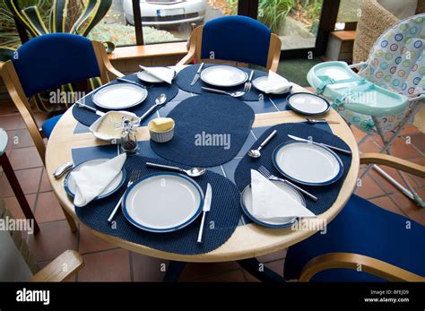 A table set for a family dinner Stock Photo - Alamy