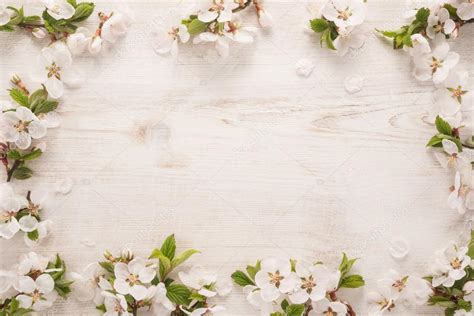 Spring flowers frame on wooden background Stock Photo by ©slava17 108597770