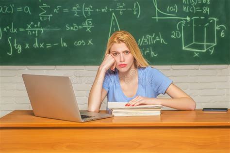 Student Studying Stressed Headaches For Test Or Exams In Classroom