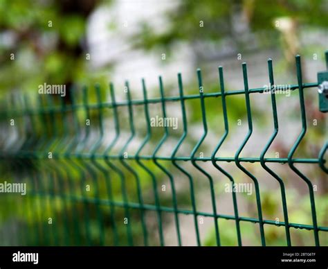 Metal mesh garden fence Stock Photo - Alamy