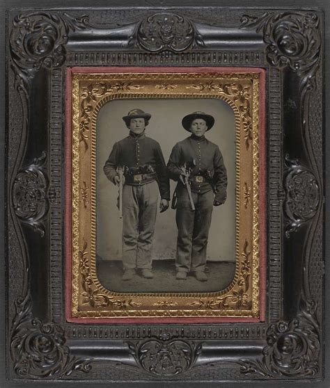 [Two unidentified soldiers in Union cavalry uniforms with Sharps rifles ...