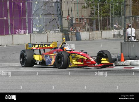 Yellow Red Race Car Speeding Around Corner During Race Stock Photo Alamy