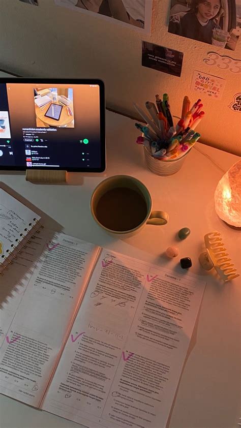 An Open Book Sitting On Top Of A Desk Next To A Cup Of Coffee And Cell