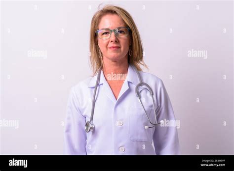 Mature Beautiful Blonde Woman Doctor Against White Background Stock Photo Alamy