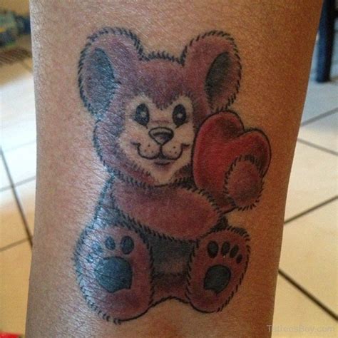 Attractive Teddy Bear With Heart Tattoo - Tattoos Designs