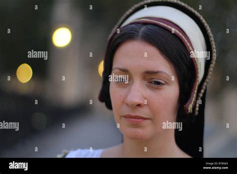 A Beautiful But Sad Dark Haired Tudor Woman In Authentic Tudor Dress