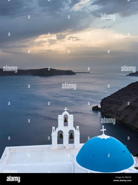 The Three Bells Of Fira With Blue Dome A Greek Orthodox Church On The