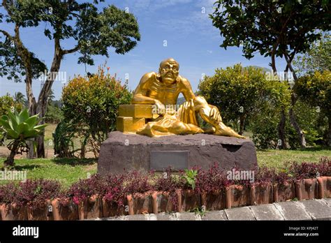 fat monk statue in complex Pagoda Ekayana Stock Photo - Alamy