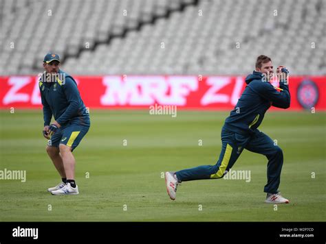 Australias Aaron Finch Left Watches Australias Steve Smith Right