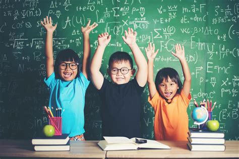 kid raising his hand in classroom 5429425 Stock Photo at Vecteezy