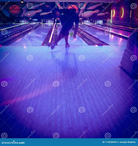 Man Bowling Under Black Light Stock Photo - Image of ball, alley: 114328944