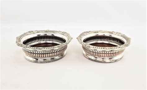 Pair Of Antique English Silver Plated Bottle Coasters With Turned