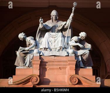 Statue of Saint Mungo, the patron saint of Glasgow, with the symbols ...