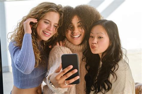 Premium Photo Cheerful Diverse Women Taking Selfie