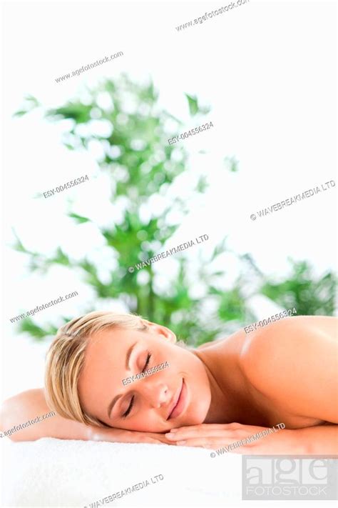 Good Looking Blonde Woman Relaxing On A Lounger With Eyes Closed Stock Photo Picture And Low