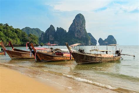 Premium Photo Traditional Thai Longtail Boats Moored On The Railay Beach