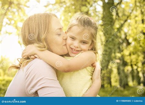 Mother And Daughter Outdoors In A Meadow Stock Image Image Of Kiss