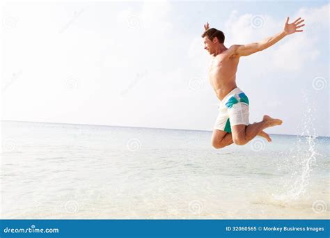 Man Jumping In The Air On Tropical Beach Stock Image Image Of Jumping