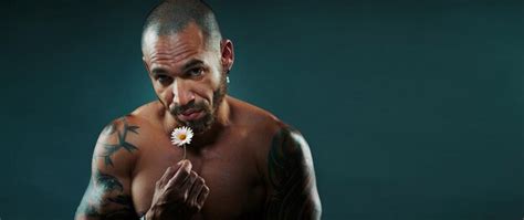 Premium Photo Latino Or Cuban With Naked Strong And Muscular Torso Holds Small White Chamomile