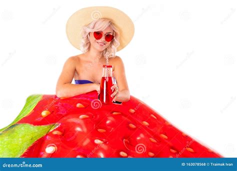 Pretty Blonde Caucasian Female Stands In Swimsuit With Rubber Beach Strawberry Mattress Juice