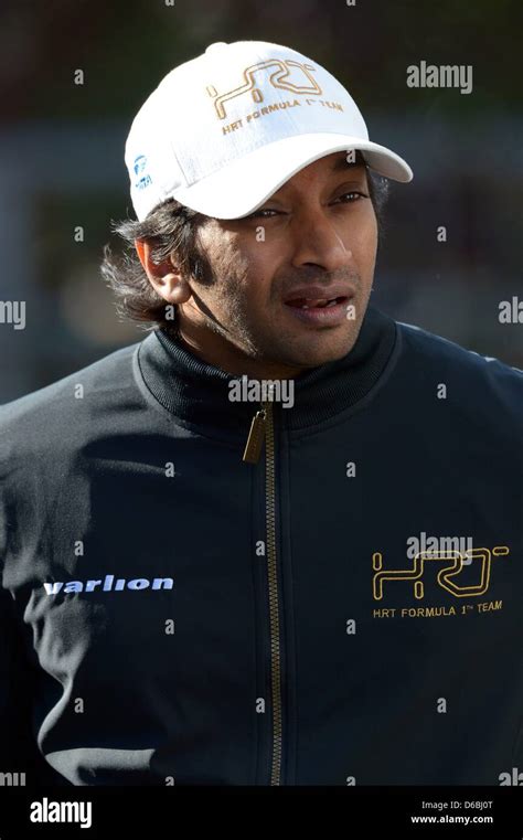 Indian Formula One Driver Narain Karthikeyan Of HRT Arrives The Paddock