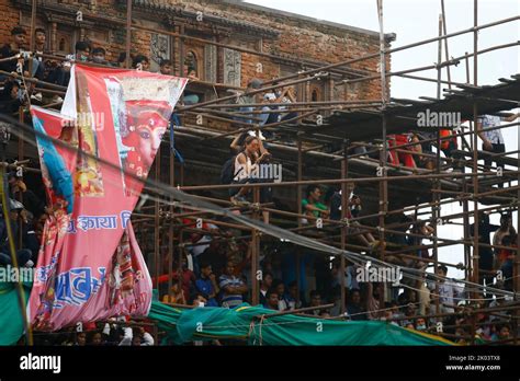 People Climb On Top Of A Temple To Watch The Procession At Basantapur