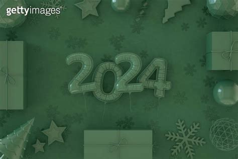 New Year Balloons And Christmas Ornaments On Green Background