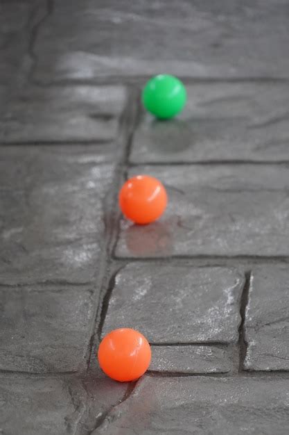 Premium Photo | Colorful balls on the concrete floor