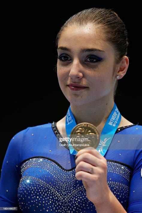 Aliya Mustafina Of Russia Poses After Winning The Gold Medal In The