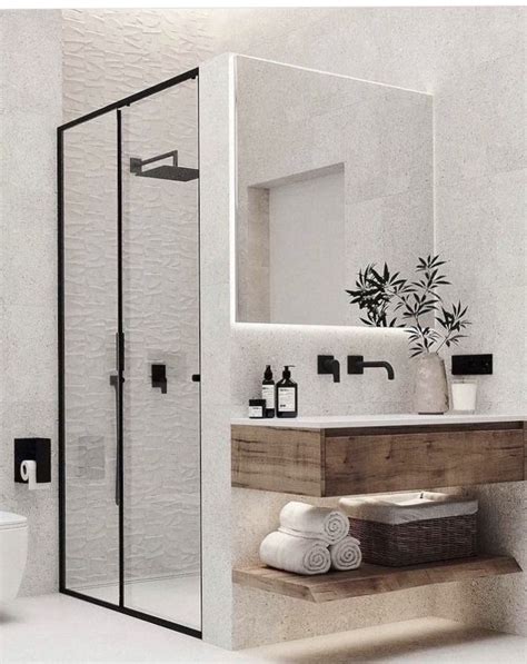 A Bathroom With A Toilet Sink And Shower