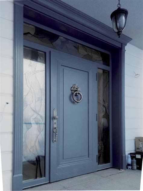 A Blue Front Door With An Ornate Handle On It