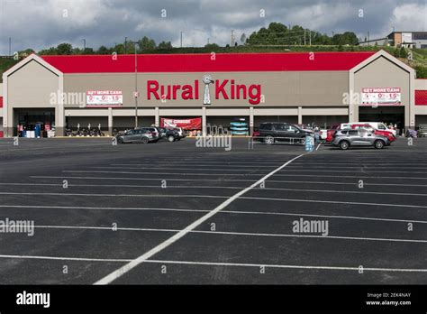 A logo sign outside of a Rural King Supply retail store location in ...