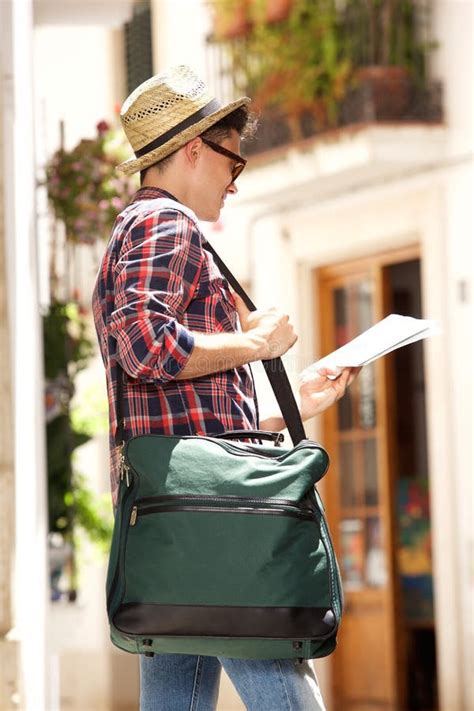 Young Travel Man Holding Bag And Reading Map Stock Image Image Of