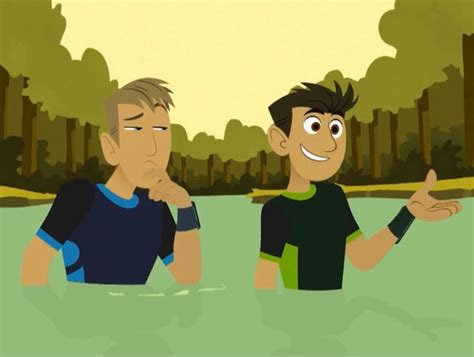 Two Men Are Standing In The Water And One Is Pointing His Finger At