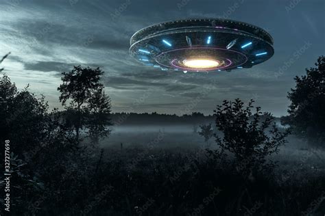 UFO An Alien Plate Hovering Over The Field Hovering Motionless In The