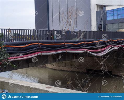 Communications Go Under the Bridge on the River. Wires and Pipes Under the Bridge Stock Image ...