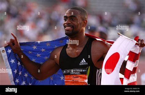 Tyson Gay Poses With An American Flag After Winning The Meters In In The USA Track